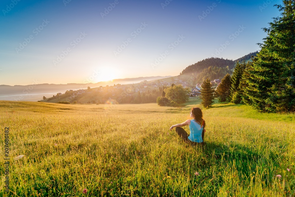 Fototapeta premium Female enjoying life at sunny morning.