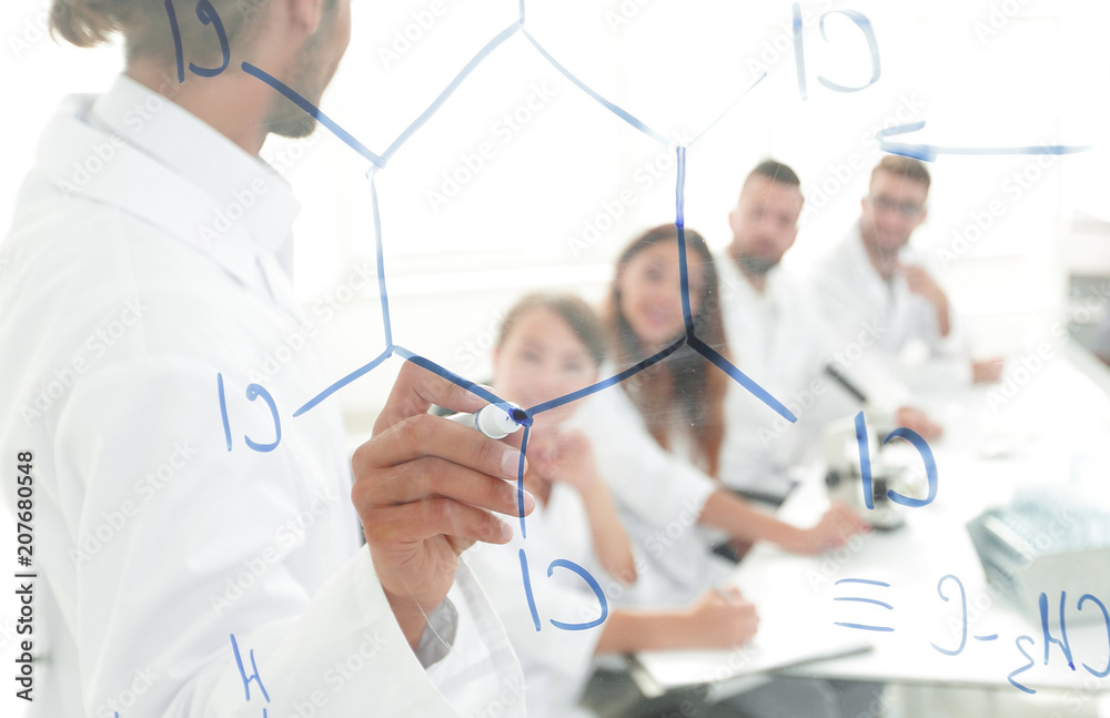 view through the transparent Board. a scientist makes a report. view through the transparent Board. a scientist makes a report.