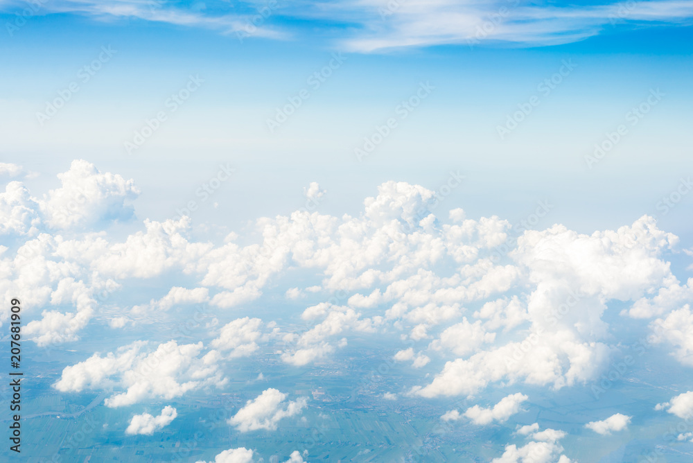 Skyline View above the Clouds from Airplane Skyline View above the Clouds from Airplane