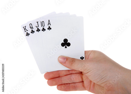 Young female hand holding Playing cards, royal flush. It is a straight flush that has a high card value of Ace. This is the highest hand in the game of poker. Spades. Generic cards NO FACES SHOWING photo