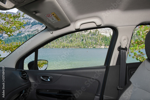Car window view of lake in Yosemite National Park, USA