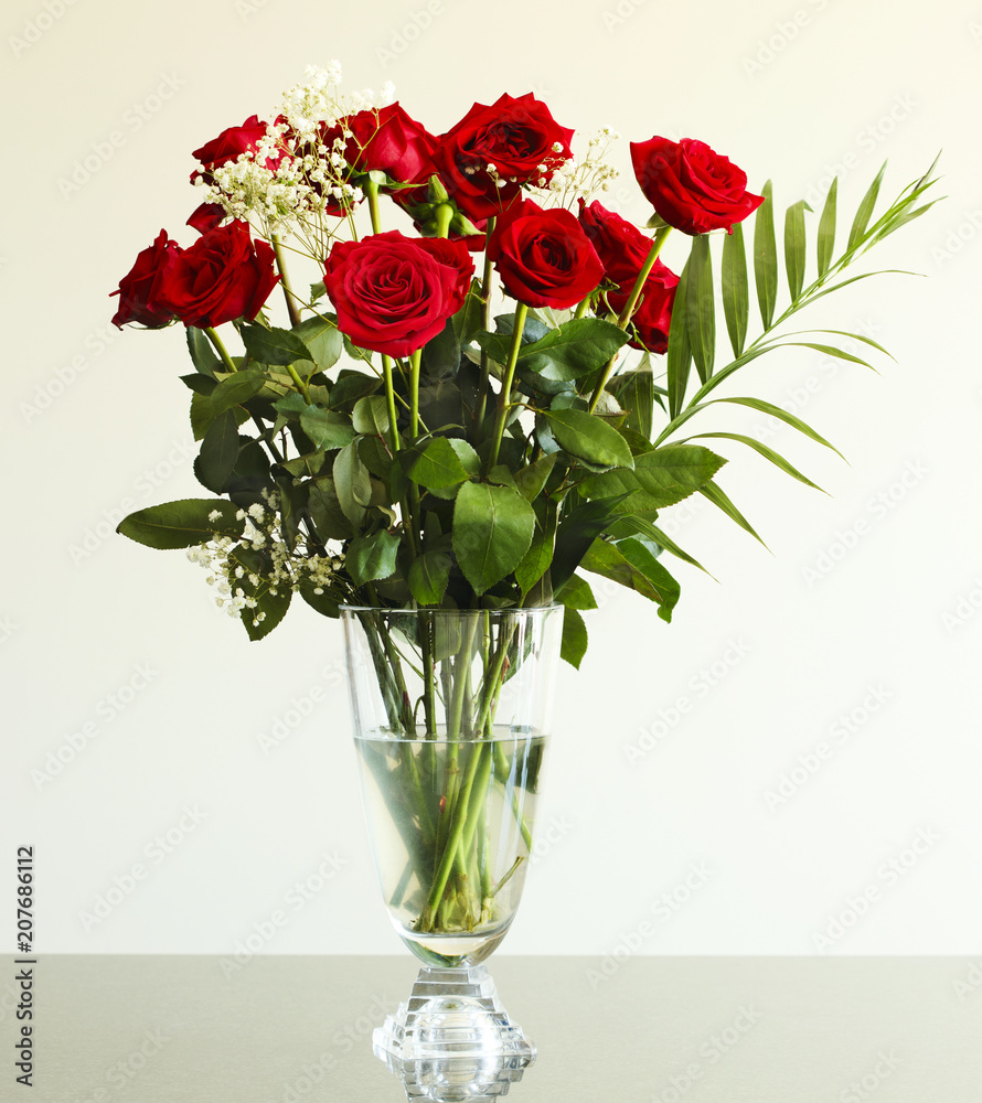 Fototapeta premium Bouquet of red roses on the table