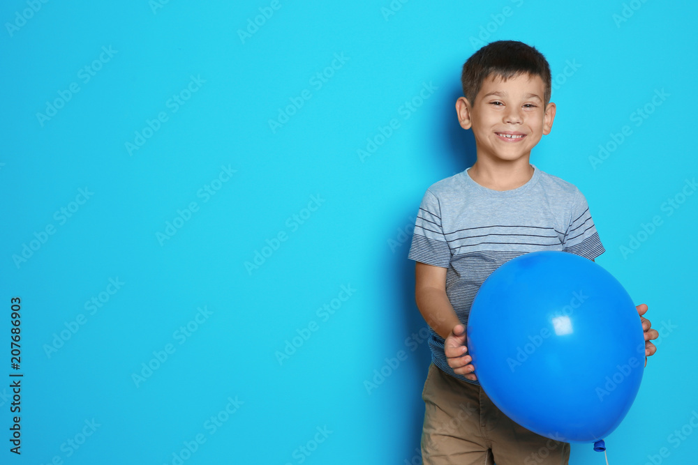 Cute boy with balloon on color background. Birthday celebration Cute boy with balloon on color background. Birthday celebration