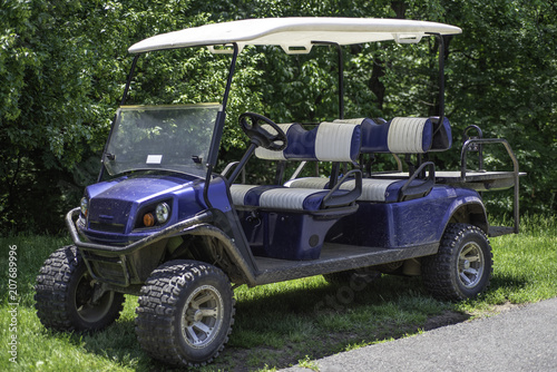 Blue-white dirty club Car Golf Cart.