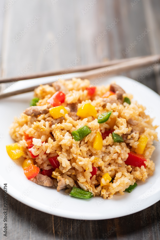 Fried rice with vegetables and pork, Asian cuisine Fried rice with vegetables and pork, Asian cuisine