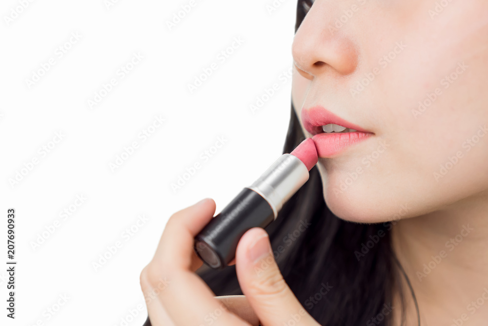 Close up of woman applying red lipstick with brush on mouth skin beauty and health, for spa products and make up. The skin is smooth and beautiful. concept of healthy women. Close up of woman applying red lipstick with brush on mouth skin beauty and health, for spa products and make up. The skin is smooth and beautiful. concept of healthy women.