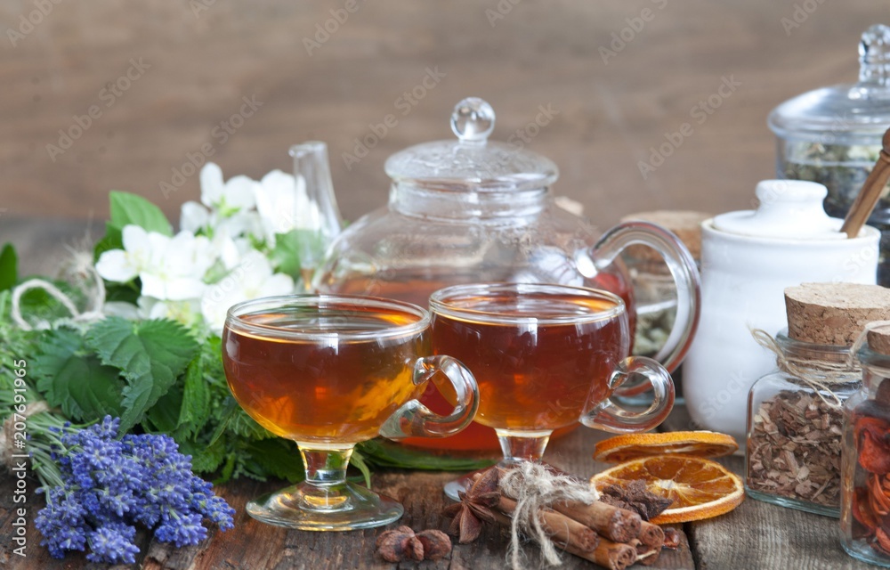 Cup of herbal tea with wild flowers and various herbs Cup of herbal tea with wild flowers and various herbs