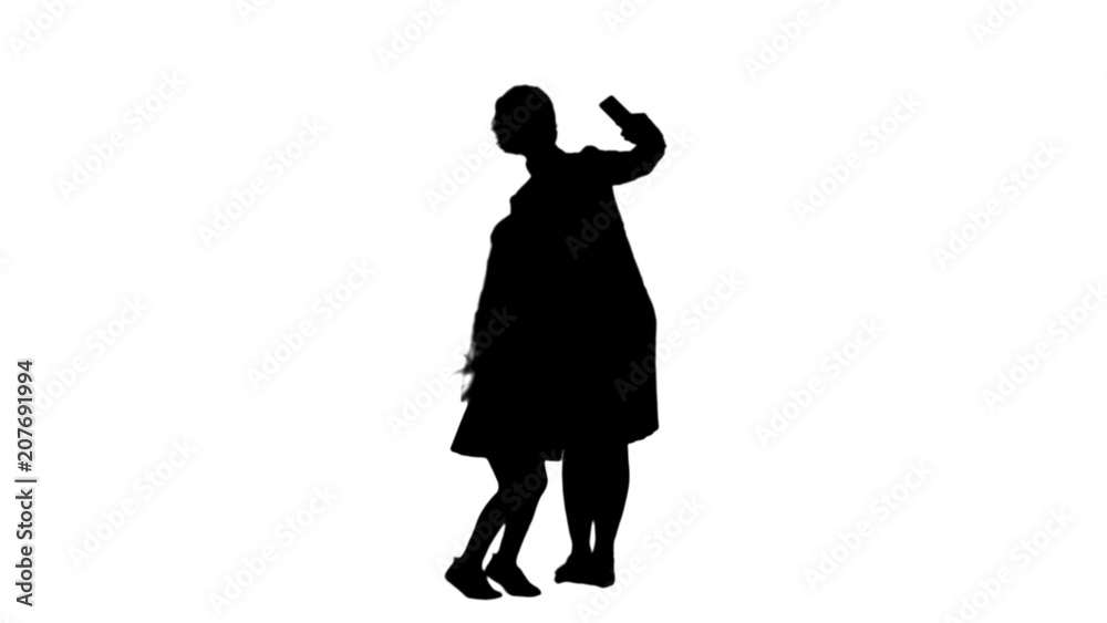 Silhouette Smiling mother and daughter bonding together to take a selfie track matte