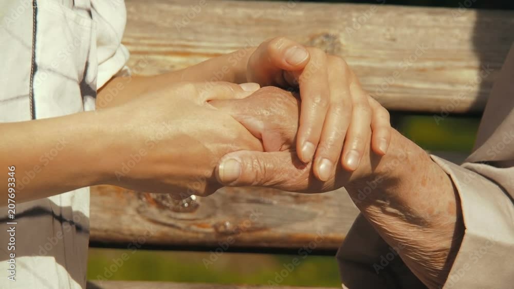 Hands of the elderly. Daughter regrets the hands of an elderly mother. Hands of the elderly. Daughter regrets the hands of an elderly mother.