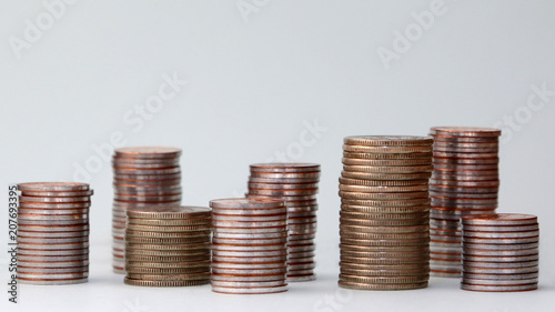 Piles of different heights of coins.