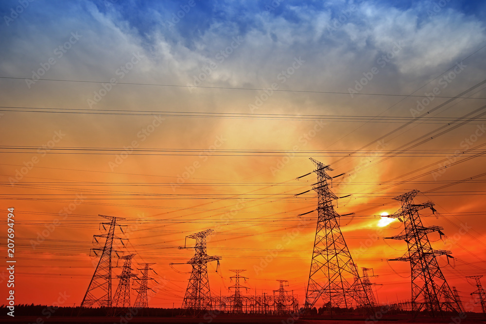 Fototapeta premium Electric tower, silhouette at sunset