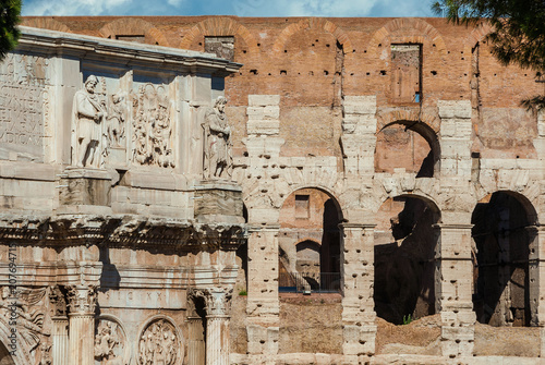 Antiquities, archeology and vistiges of the past in Rome. Coliseum monumental arches and Arch of Constantinus side by side