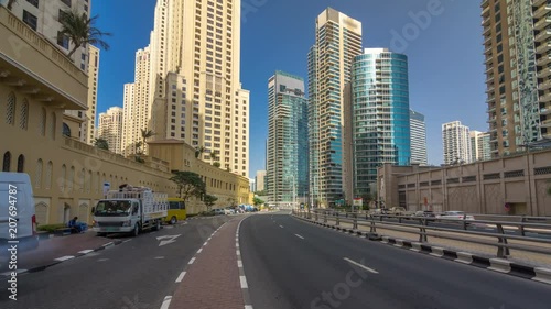 A view of traffic on the street at Jumeirah Beach Residence and Dubai marina timelapse hyperlapse, United Arab Emirates. photo