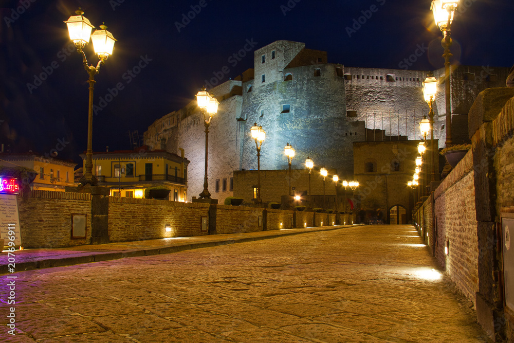 Evening image of Castel Dell Ovo in the Bay of Naples during the blue hour.