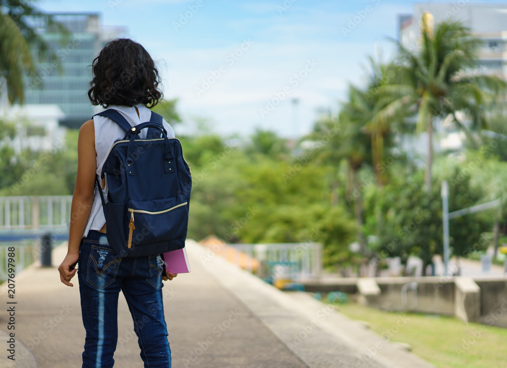 asian children holding book in hand together going to the school.education and people concept.back to school asian children holding book in hand together going to the school.education and people concept.back to school
