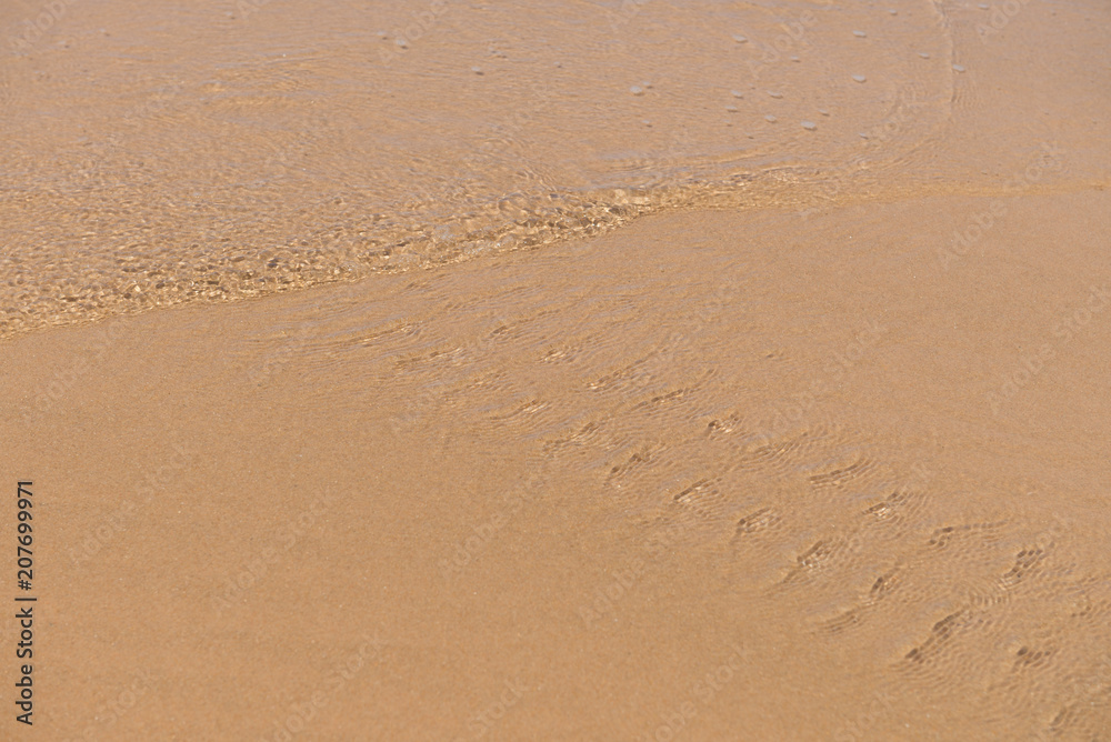 Texture beach sandy surface with ripples formed Texture beach sandy surface with ripples formed