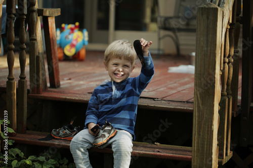 Photo of adorable young happy boy looking at camera.