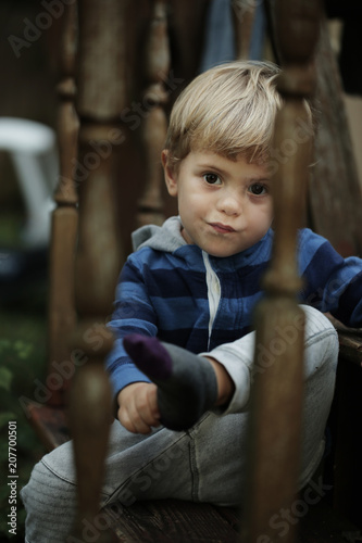 Photo of adorable young happy boy looking at camera.