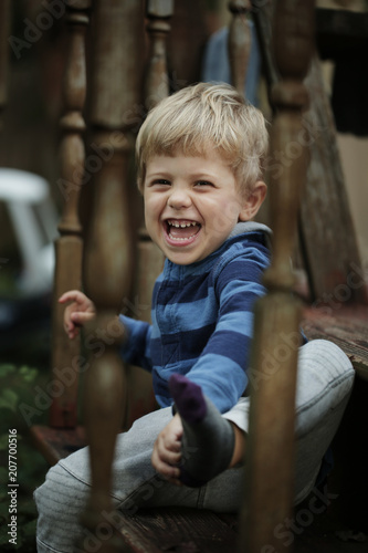 Photo of adorable young happy boy looking at camera.
