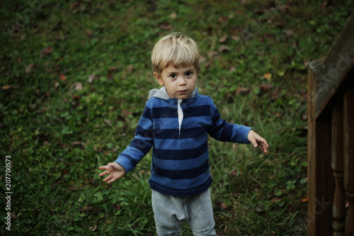 Photo of adorable young happy boy looking at camera.