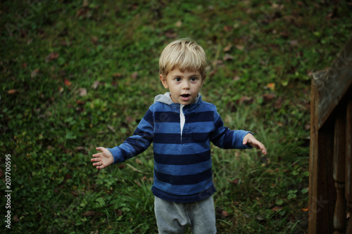 Photo of adorable young happy boy looking at camera.