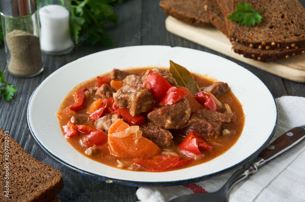 Stewed beef in tomato sauce with vegetables Stewed beef in tomato sauce with vegetables