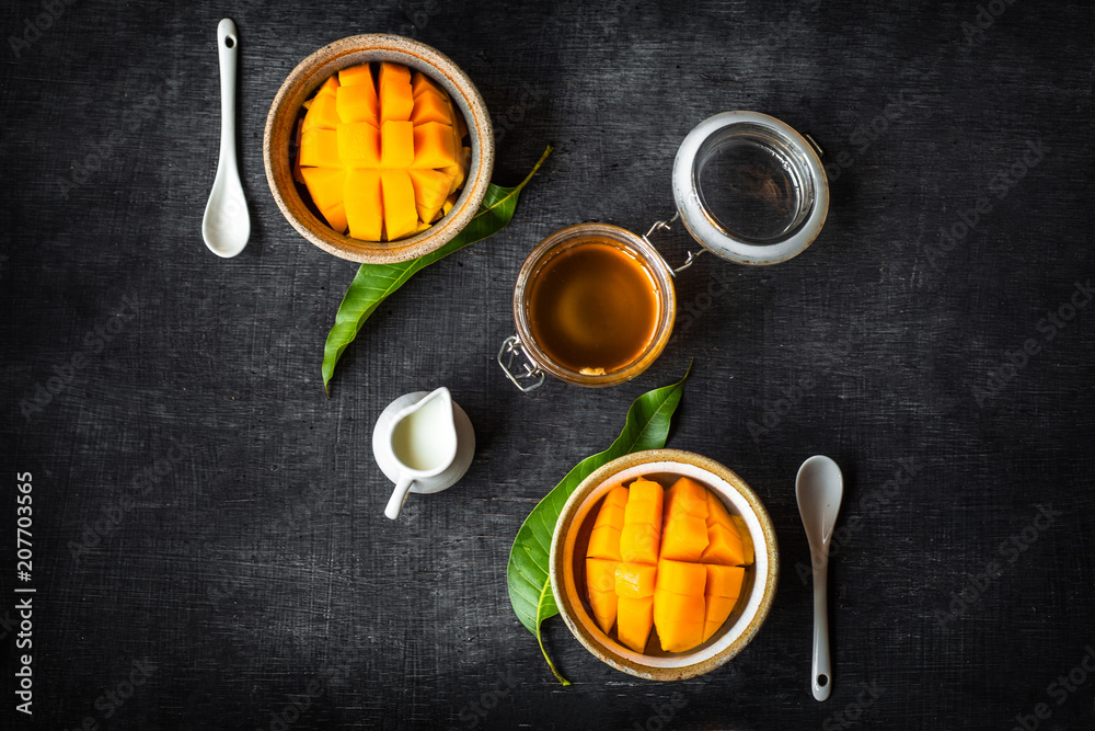 Yellow Mango peel In the cup And honey and coconut milk Yellow Mango peel In the cup And honey and coconut milk