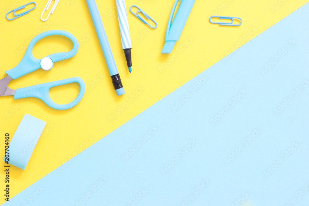 Blue school supplies on a yellow blue desk.Back to school background ...