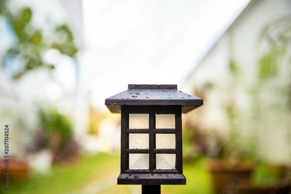 Botanic Garden Design. Solar Powered Lamp with blur abstract background.