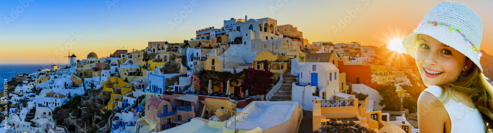 Amazing portrait of a young girl with panorama view of Oia village on Santorini island in Greece.
