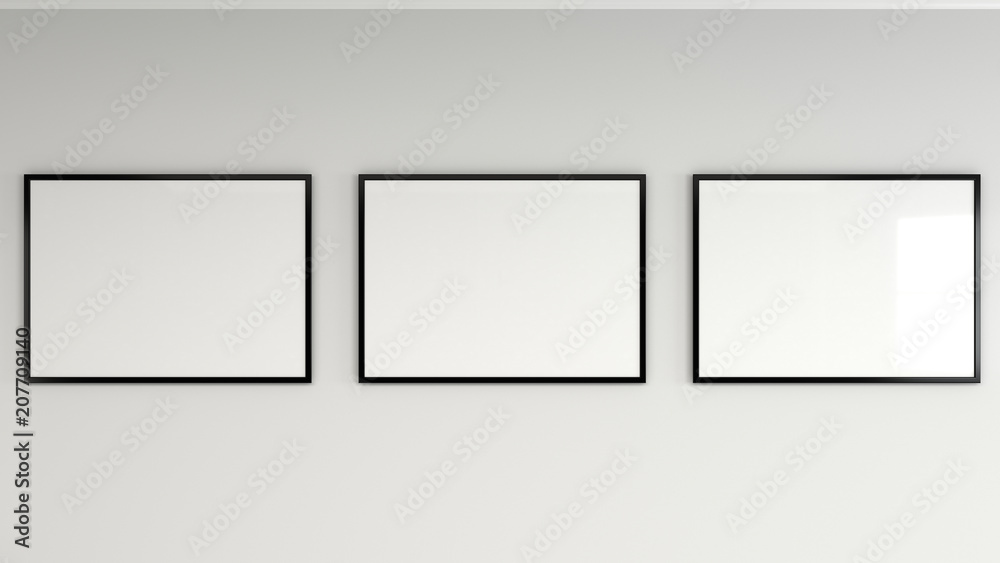 Blank white poster in black frame on the wall Blank white poster in black frame on the wall