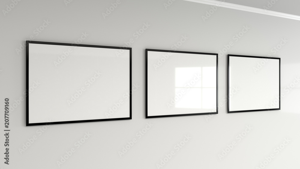 Blank white poster in black frame on the wall Blank white poster in black frame on the wall