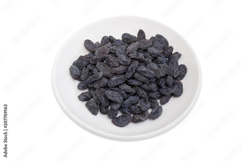 Raisins on the saucer on a white background Raisins on the saucer on a white background