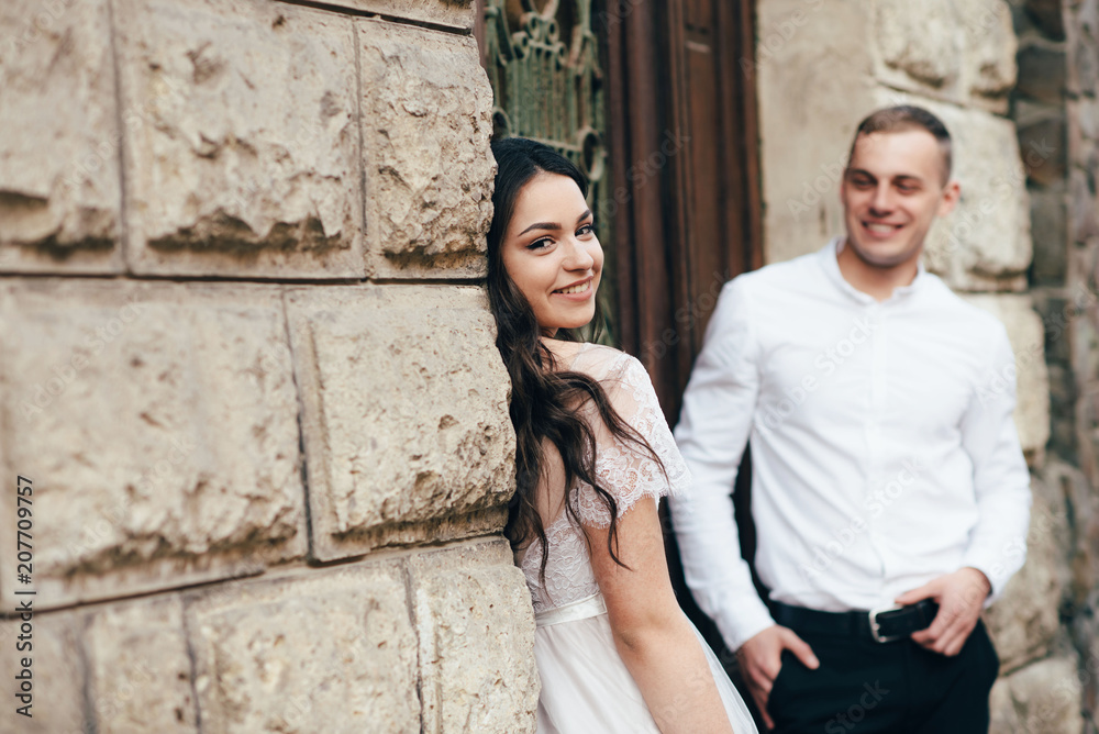 A young, sympathetic couple walks through the streets of the city. A young, sympathetic couple walks through the streets of the city.