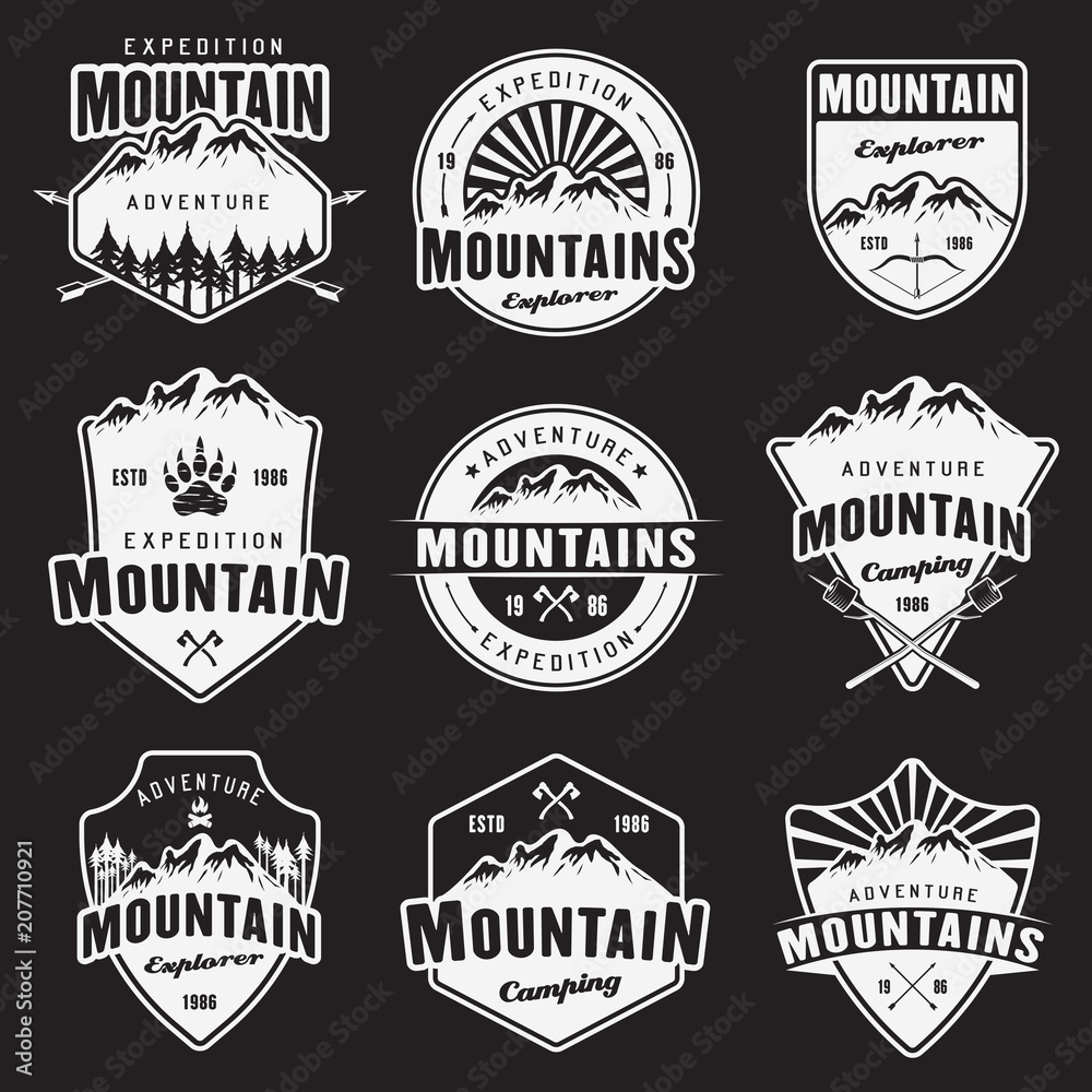 Mountain travel white vector emblems on dark