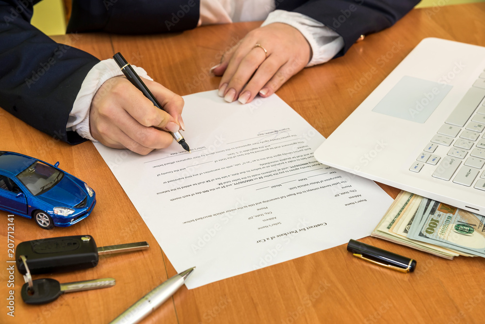 woman buys a car signing a contract woman buys a car signing a contract