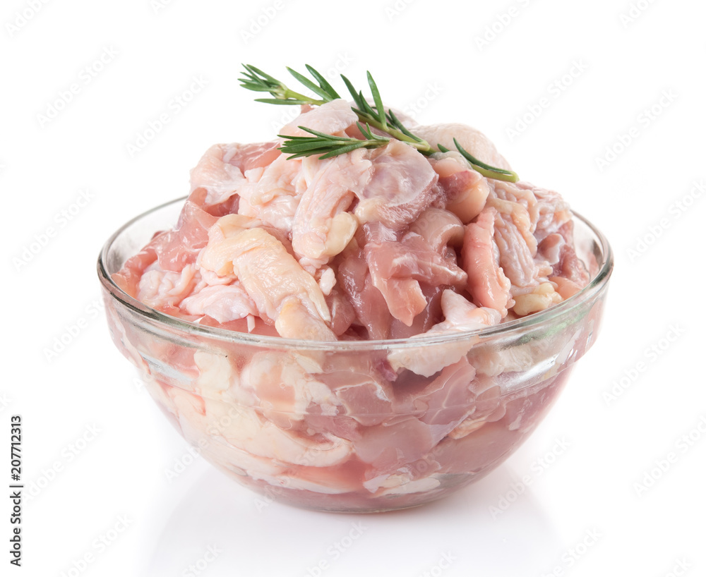 Small piece raw chicken in glass bowl isolated on white background Small piece raw chicken in glass bowl isolated on white background