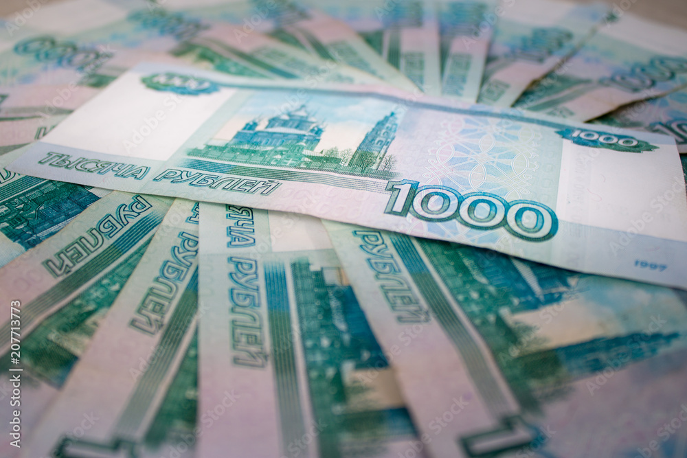 business, finance, saving, banking concept - close up bundle of money Russian Banknotes thousand rubles business, finance, saving, banking concept - close up bundle of money Russian Banknotes thousand rubles