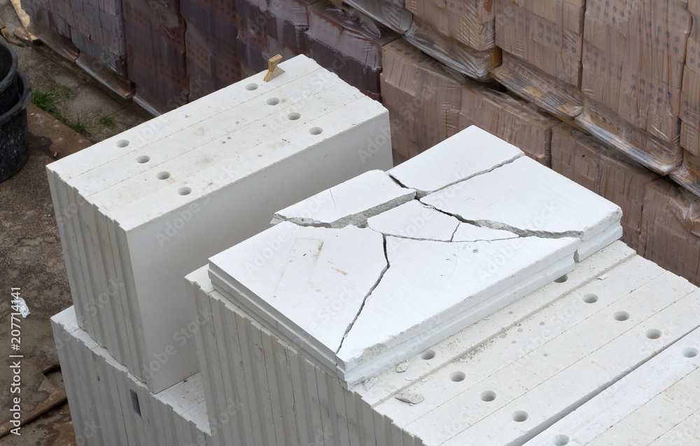 Building site with house under construction - Building materials Building site with house under construction - Building materials
