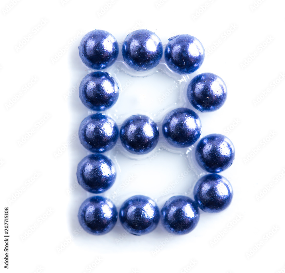 Blue beads font letter of english alphabet on white background Blue beads font letter of english alphabet on white background