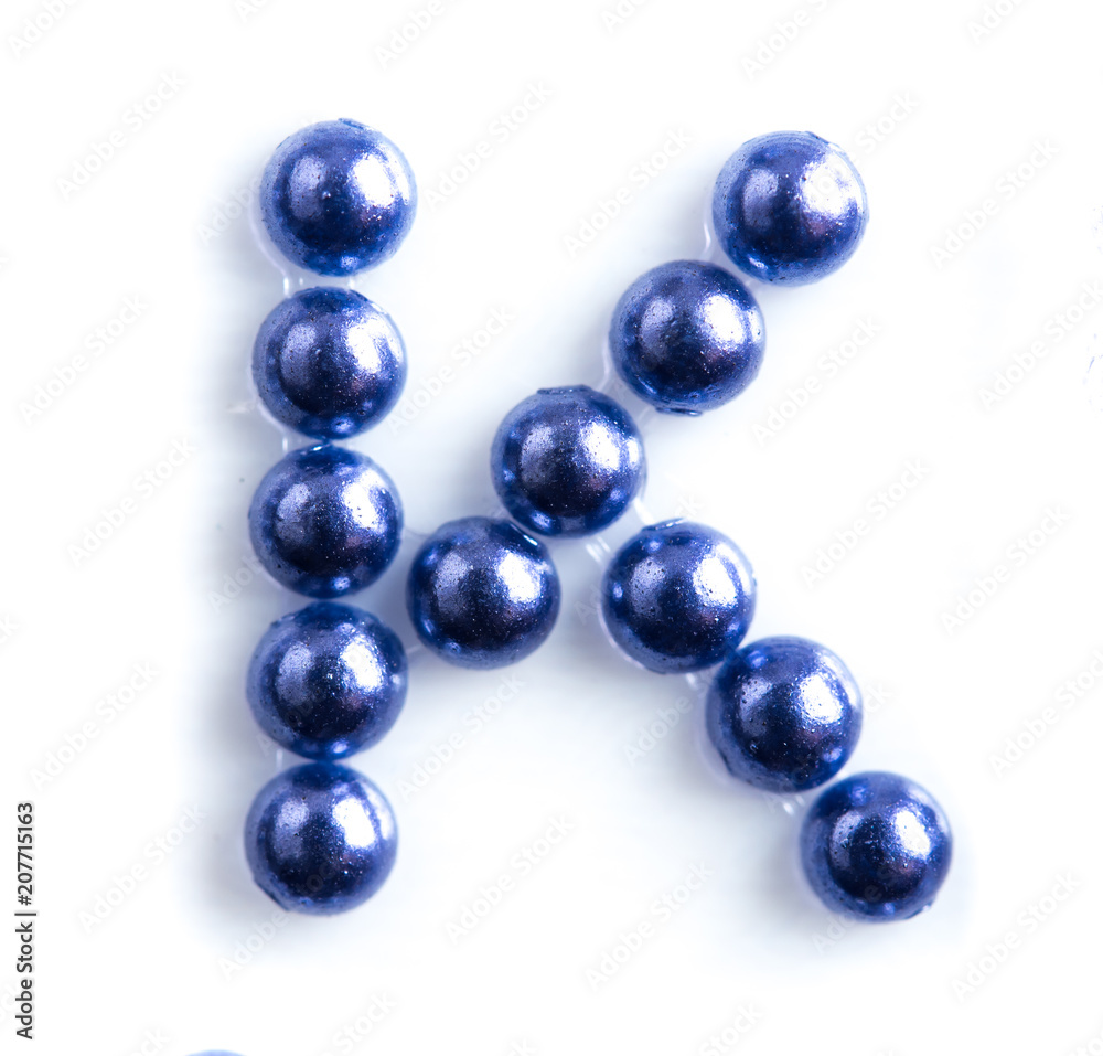 Blue beads font letter of english alphabet on white background Blue beads font letter of english alphabet on white background