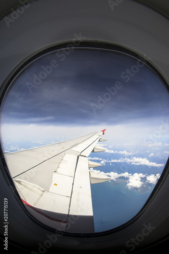 Beautiful lookout view from airplane window with visible window frame