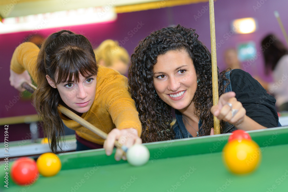 Fototapeta premium Women playing pool
