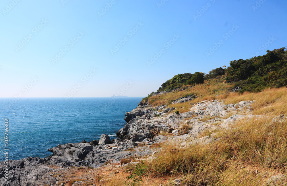 Beach, sea waves and blue sea at Sichang Island, Chonburi, Thailand