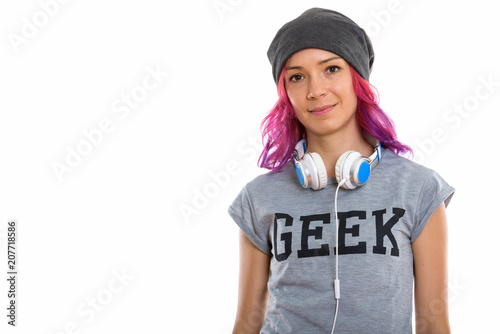 Studio shot of geek girl with headphones around neck
