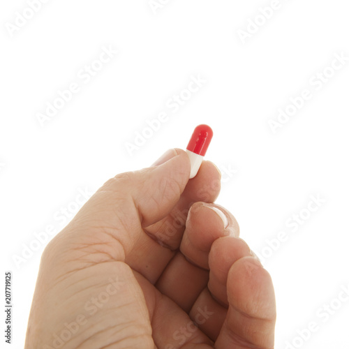 Old hand with capsule pill