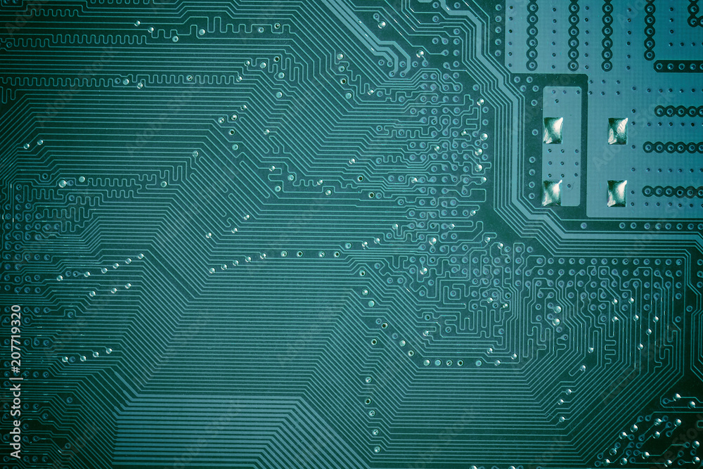 Close up of green circuit computer motherboard. Computer technology background.