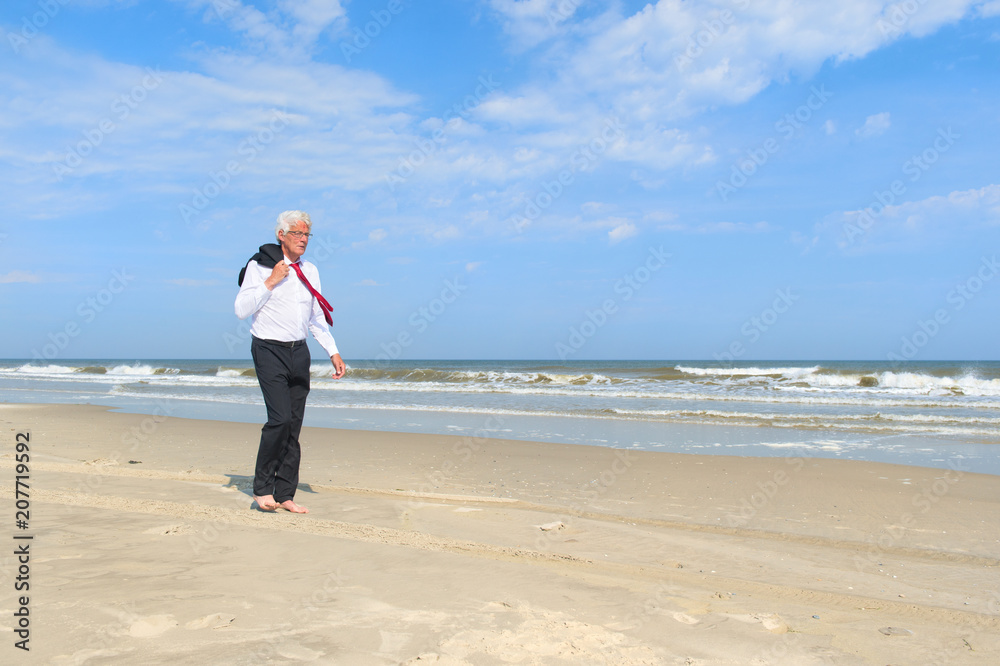 Business man at the beach