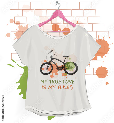 
White T-shirt hanging on hangers. Pink hanger. Brick wall.