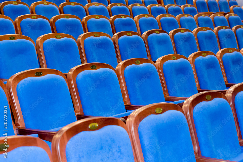 Fototapeta premium Blue brown wooden chairs in the auditorium. Without people
